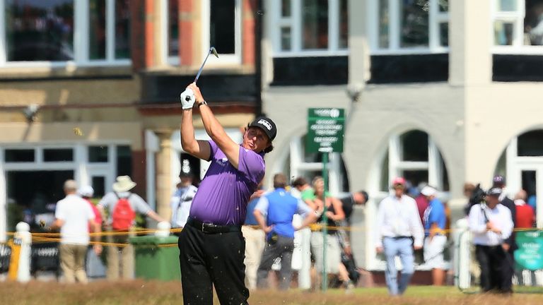 Defending Open champion Phil Mickelson reached the halfway point on par after cancelling out an earlier bogey with a birdie two at the ninth