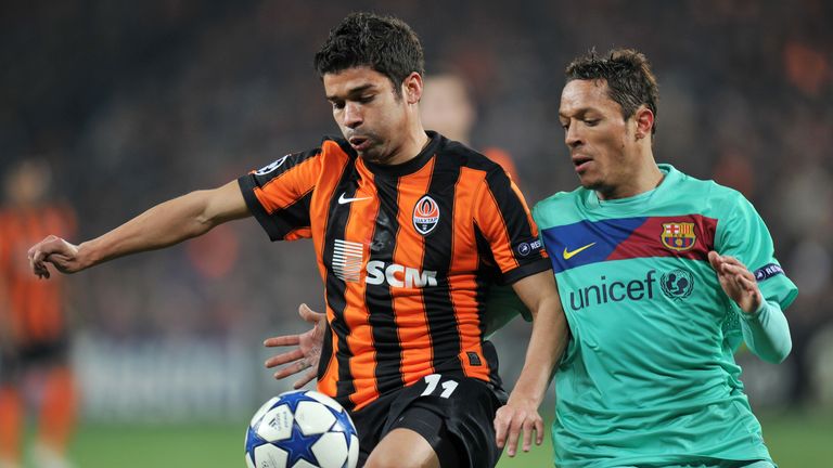 Eduardo of FC Shakhtar fights for a ball with Adriano of FC Barcelona during their UEFA Champions League, quarter-finals, second leg football match