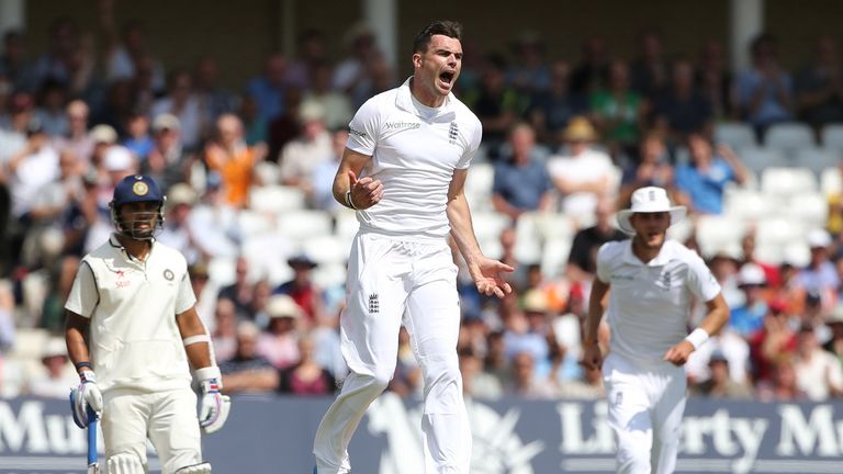 England's James Anderson (C) celebrates after taking the wicket of India's Shikhar Dhawan during the first day of the first cricket Test match between Engl