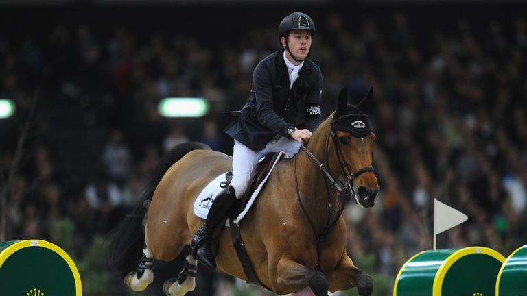 GENEVA, SWITZERLAND - DECEMBER 15:  Scott Brash of Great Britain on Hello Sanctos on their way to 2nd place during the Rolex Grand Slam of Show Jumping at 
