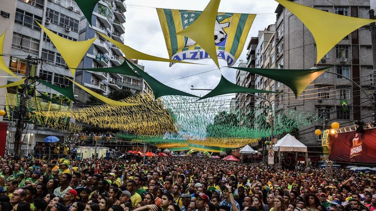 Brazil's fans react during a public viewing event at a street in Rio de Janeiro during the 2014 FIFA World Cup semifinal match Brazil vs Germany --being he