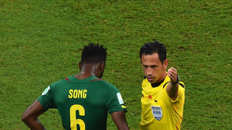 MANAUS, BRAZIL - JUNE 18: Alex Song of Cameroon is sent off after a red card by referee Pedro Proenca during the World Cup clash v Croatia