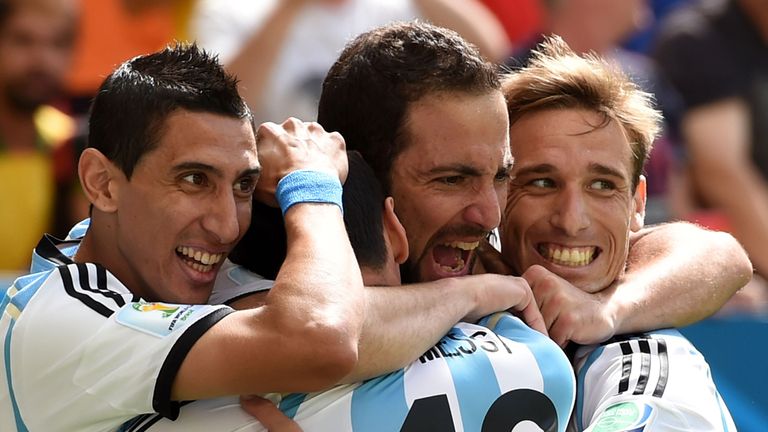 BRASILIA, BRAZIL - JULY 05: Gonzalo Higuain of Argentina (2nd L) celebrates scoring his team's first goal with Angel di Maria (L), Lionel Messi (2nd L) and