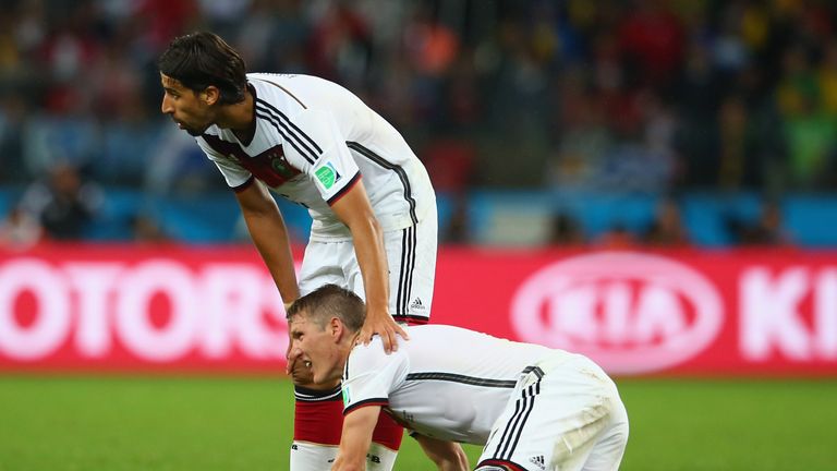PORTO ALEGRE, BRAZIL - JUNE 30:  Bastian Schweinsteiger of Germany kneels on the field as Sami Khedira looks on during the 2014 FIFA World Cup Brazil Round