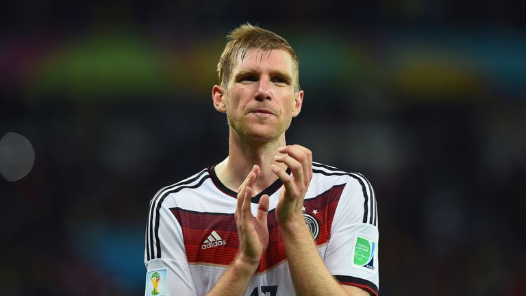 Per Mertesacker applauds the fans after Germany's World Cup win v Algeria
