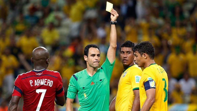 FORTALEZA, BRAZIL - JULY 04: Thiago Silva of Brazil is shown a yellow card by referee Carlos Velasco Carballo during the 2014 FIFA World Cup Brazil Quarter