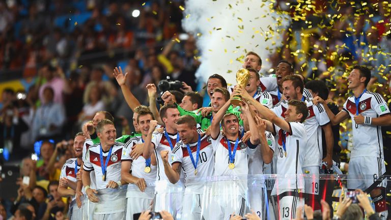 RIO DE JANEIRO, BRAZIL - JULY 13:  Philipp Lahm of Germany lifts the World Cup trophy with teammates after defeating Argentina 1-0 in extra time during the