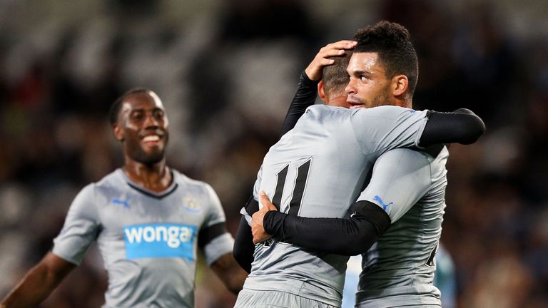 DUNEDIN, NEW ZEALAND - JULY 22:  Yoan Gouffran of Newcastle United is congratulated on his goal by Emmanuel Riviere and Vurnon Anita (L) during the interna