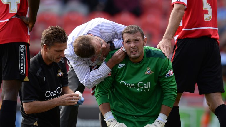 Ross Turnbull of Doncaster is injured during the Sky Bet Championship against Blackpool