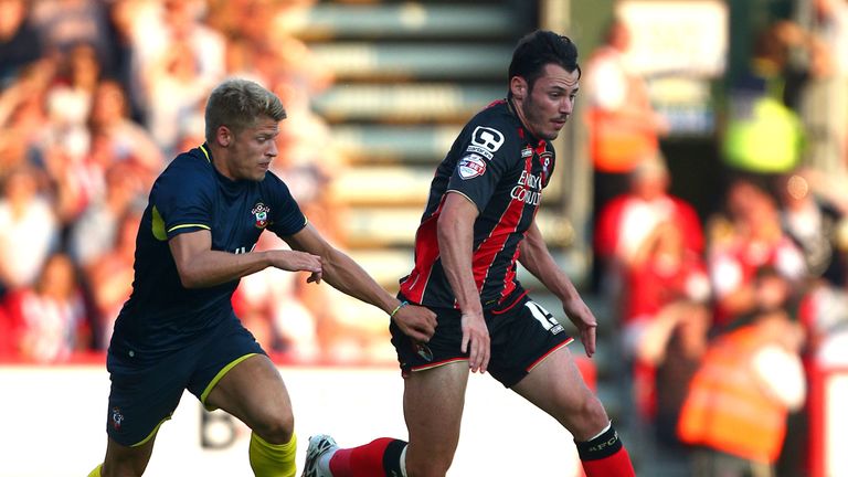  Adam Smith of Bournemouth looks to get away from Southampton's Lloyd Isgrove