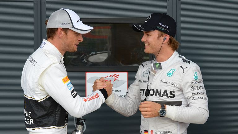 Jenson Button and Nico Rosberg celebrate in parc ferme