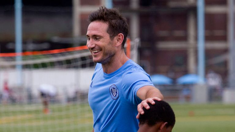 Frank Lampard, of England, engages a young player during a soccer clinic with young people after he was introduced as a New York City FC player
