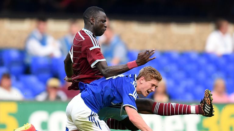 Cheikhou Kouyate of West Ham United and Teddy Bishop of Ipswich Town in action during the pre-season friendly match