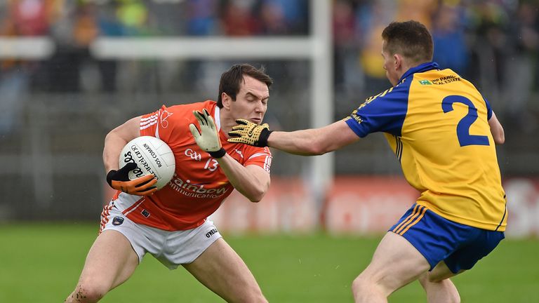 Armagh forward Tony Kernan is tackled by Seanie McDermott