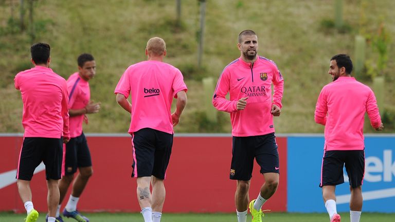 Gerard Pique of Barcelona warms up during the Barcelona Training Session at St George's Park on July 28, 2014 in Burton-upon-Trent