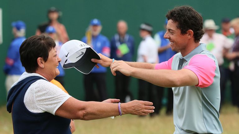 HOYLAKE, ENGLAND - JULY 20:  Rory McIlroy of Northern Ireland celebrates his two-stroke victory on the 18th green with his mother Rosie during the final ro