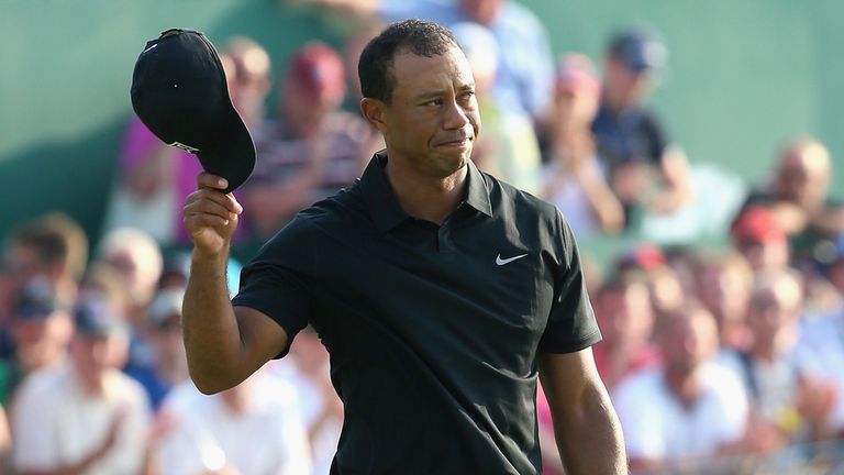  Tiger Woods of the United States waves to the crowd on the 18th green during the second round of The 143rd Open Championship