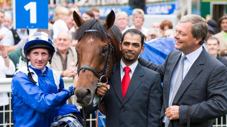 Jockey Paul Hanagan and trainer William Haggas (right) with Mukhadram after winning the Coral-Eclipse