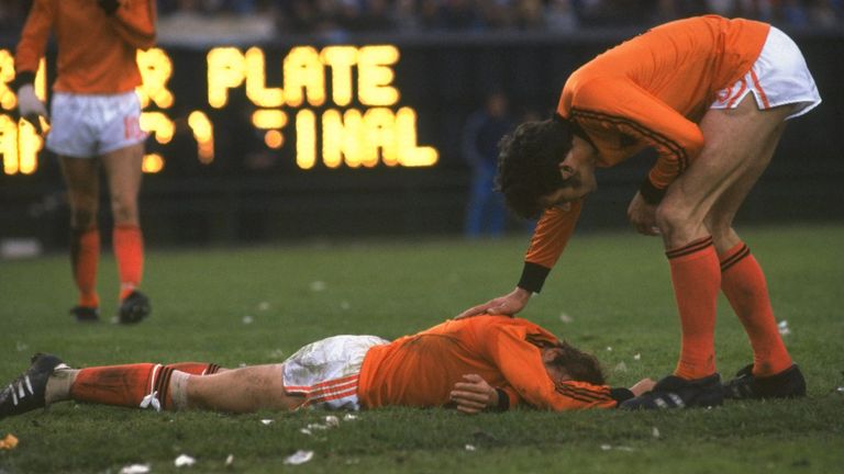 A Dutch player lies distraught whilst his team-mate tries to console him after the World Cup final between Holland and Argentina in 1978