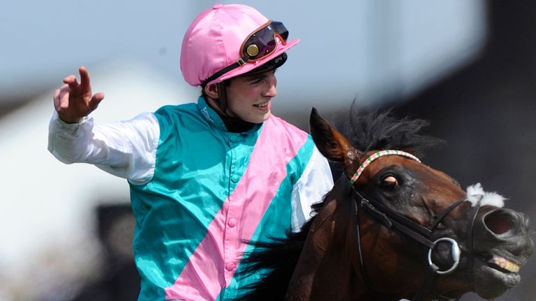 CHICHESTER, ENGLAND - JULY 30:  James Doyle riding Kingman wins The Qipco Sussex Stakes from at Goodwood racecourse on July 30, 2014 in Chichester, England