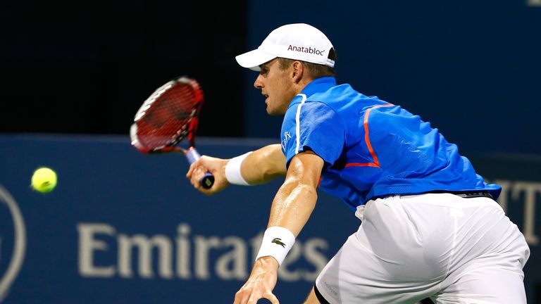 John Isner chases down a forehand shot against Robby Ginepri during the BB&T Atlanta Open at Atlantic Station on July 24, 2014 