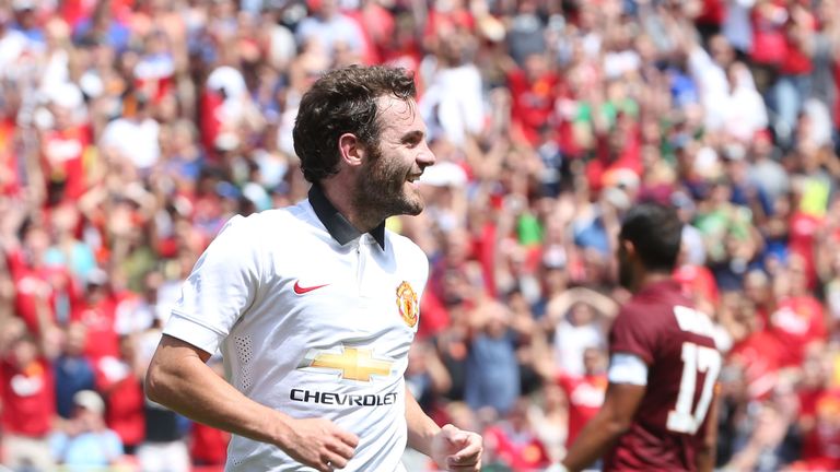 Juan Mata celebrates scoring Manchester United's second goal against Roma