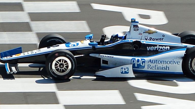 Juan Pablo Montoya of Colombia crosses the finish line to win in Pennsylvania on Sunday