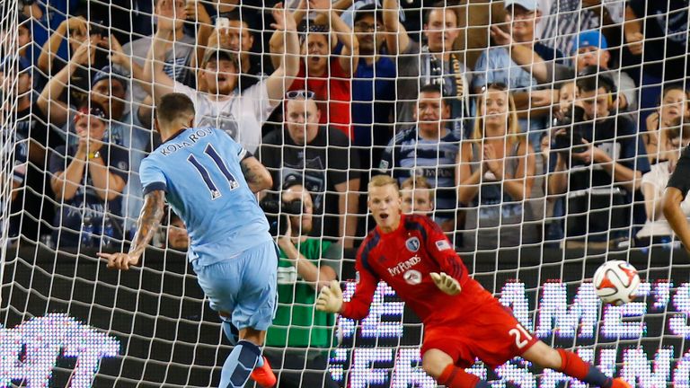 Aleksandar Kolarov of Manchester City scores a penalty past Jon Kempin