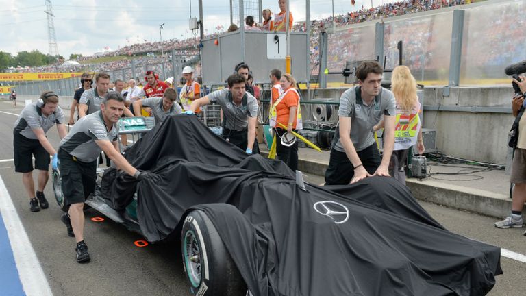 Mercedes mechanics must prepare the team's spare chassis for the race