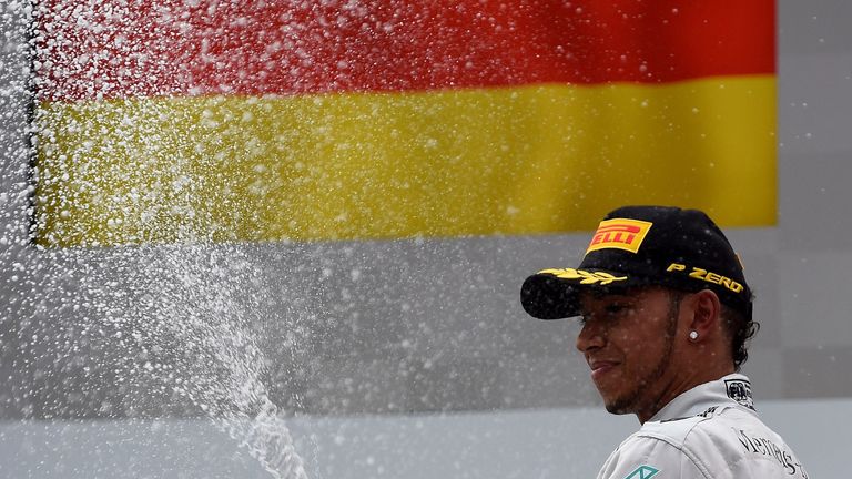 Lewis Hamilton sprays the champagne