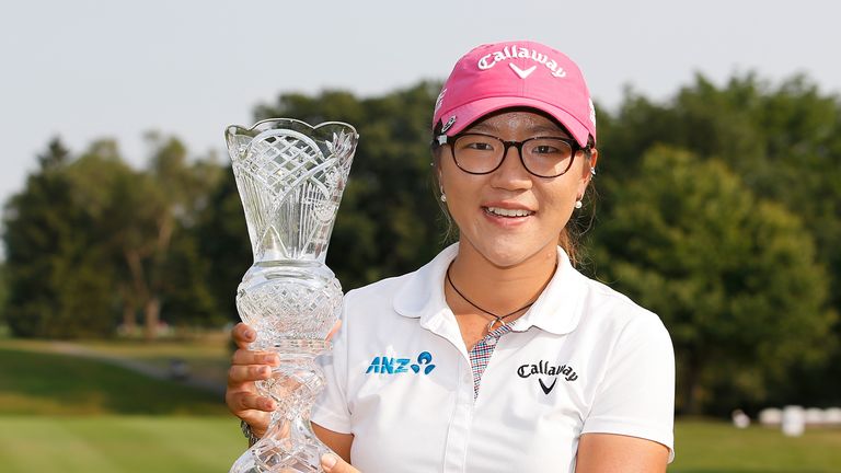 Lydia Ko of New Zealand holds the trophy after winning the the 2014 Marathon Classic 