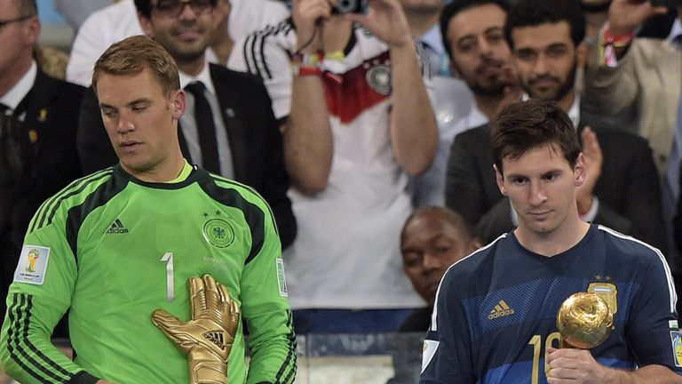 Germany's goalkeeper Manuel Neuer and Argentina's forward and captain Lionel Messi hold their respective trophies of 'Golden Glove' and 'Golden Ball'