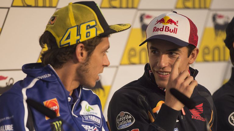 Marc Marquez (r) and Valentino Rossi chat during a press conference in Germany this week