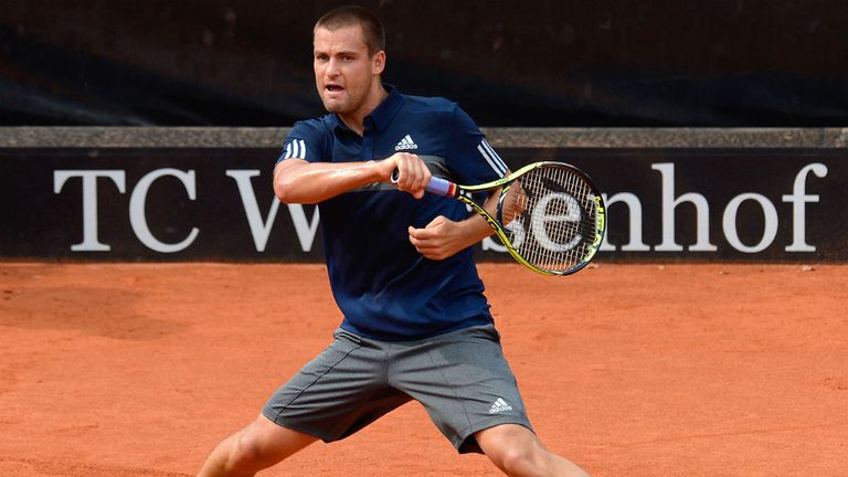 Mikhail Youzhny of Russia returns a ball during his semi-final match against Lukas Rosol of Czech Republic during day six of MercedesCup at TC Weissenhof
