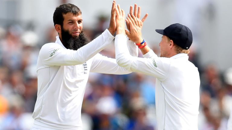 England bowler Moeen Ali is congratulated by Joe Root after taking the wicket of Stuart Binny