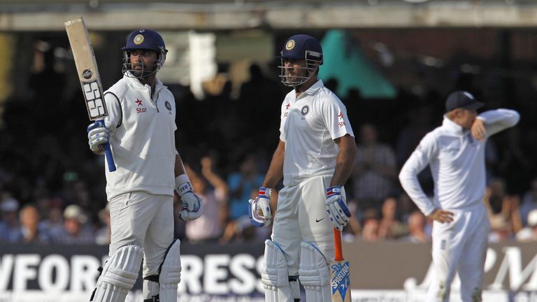 Murali Vijay: India opener (left) celebrates a painstaking half-century with his skipper MS Dhoni