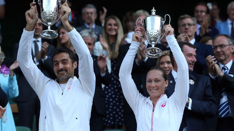 Nenad Zimonjic and Samantha Stosur with their trophies after winning the mixed doubles at Wimbledon