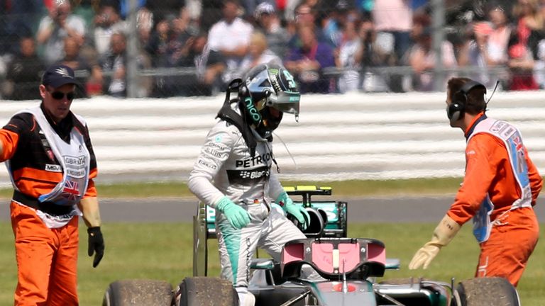  Nico Rosberg climbs out of his car after it broke down