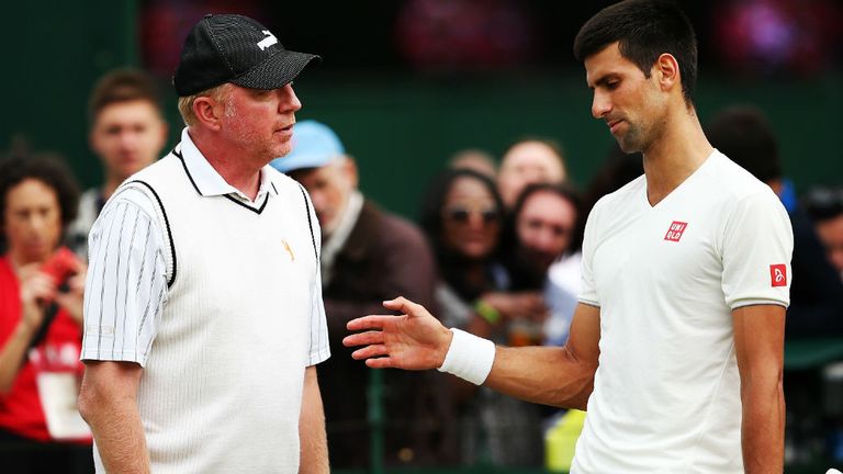 Novak Djokovic of Serbia talks with his coach Boris Becker during a practice session on day twelve of the Wimbledon Lawn Tennis Championships