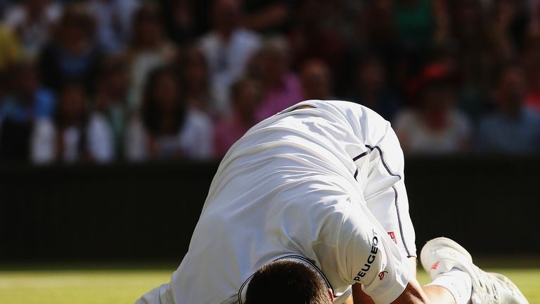 LONDON, ENGLAND - JULY 06:  Novak Djokovic of Serbia holds his head in hands during the Gentlemen's Singles Final match against Roger Federer of Switzerlan