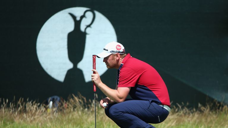 John Singleton of England lines up a putt during the first round of The 143rd Open Championship at Royal Liverpool on July 17,