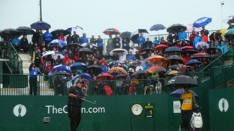 Defending champion Phil Mickelson got proceedings underway while the hardy souls at Hoylake took cover