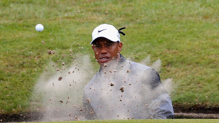 Woods hit the bunker at the par-three 15th and could only manage a bogey after making it out of the sand