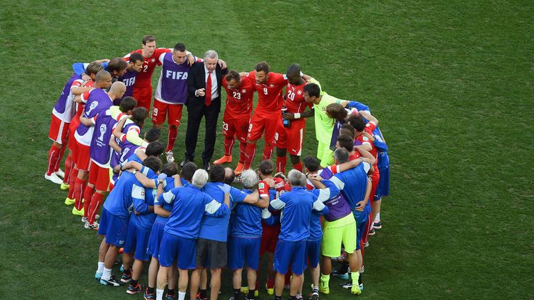 Ottmar Hitzfeld gathers his Switzerland players together as the game went into extra time