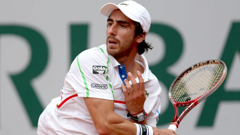 Pablo Cuevas of Uruguay returns a shot during his men's singles match against Fernando Verdasco of Spain at the French Open