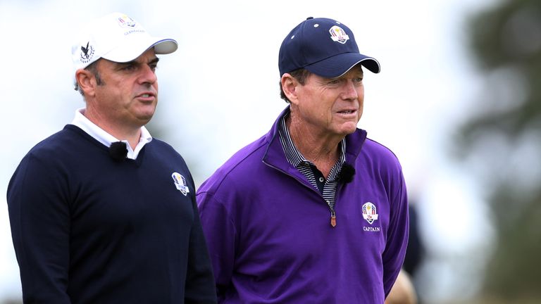 US team captain Tom Watson (R) and Europe team captain Paul McGinley (L) walk together during an event to mark one year to go before the Ryder Cup golf com
