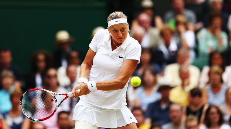Petra Kvitova plays a backhand return against Eugenie Bouchard