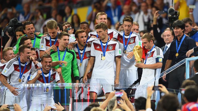 Philipp Lahm of Germany holds the World Cup trophy