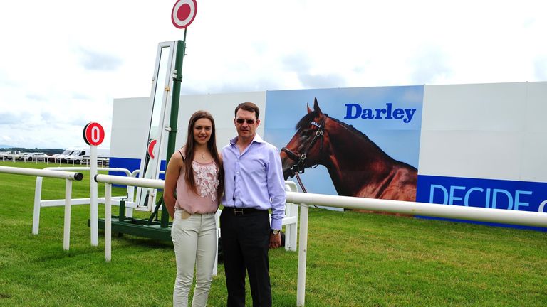 Ana O'Brien walks the course with her father Aidan during Darley Irish Oaks Day at Curragh Racecourse, County Kildare.