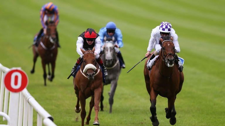 Parish Hall, ridden by Kevin Manning (right), lands the Group Three Meld Stakes at the Curragh.